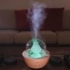 Serene Living Fountain Diffuser turned on with green light
