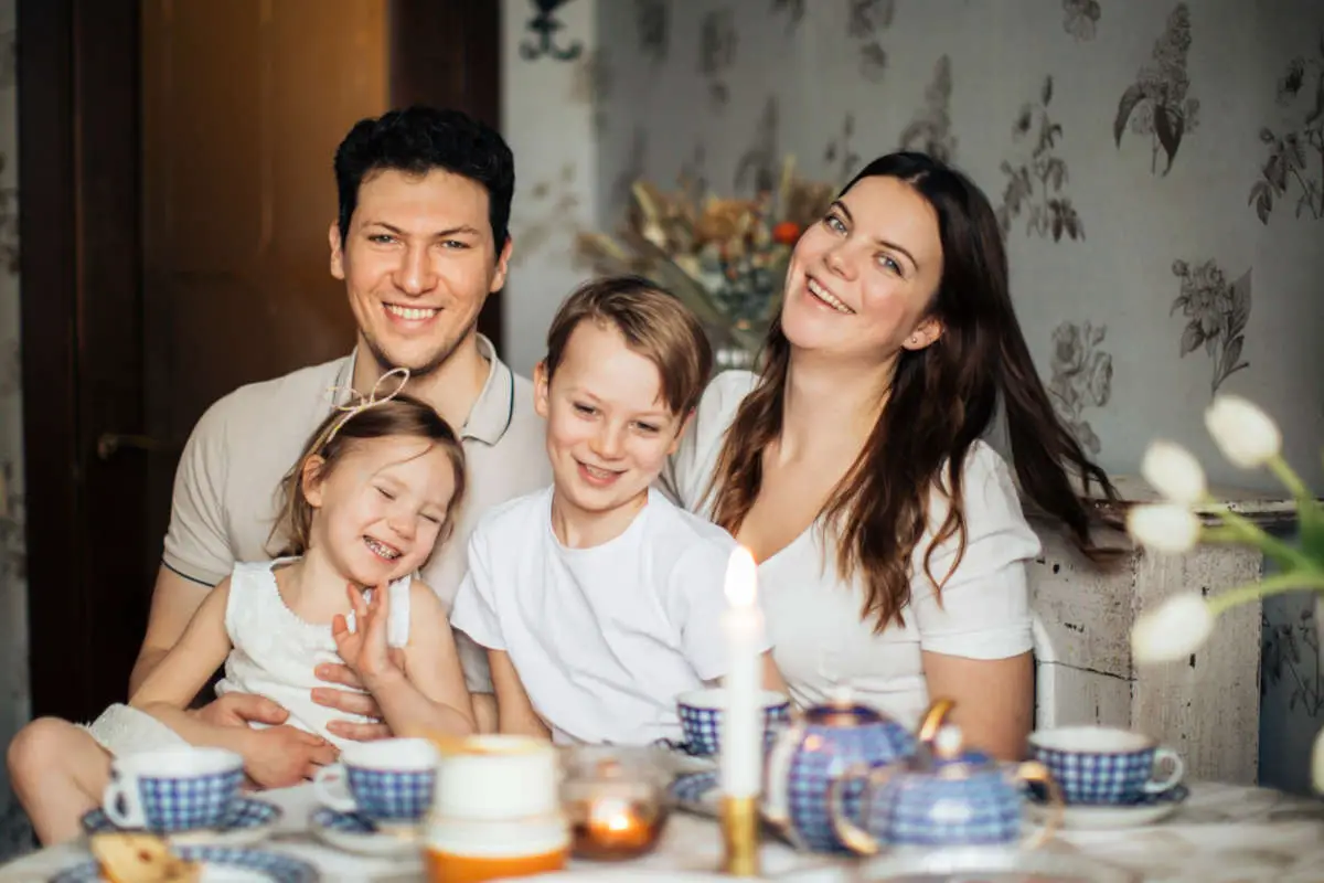 Family of 4 looking warm and cozy