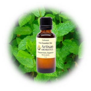 Peppermint essential oil by Artisan Aromatics on a peppermint background