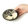 Peruvian stick incense burner made of ceramic, black and white 4.75 inches, top view with hand holding burner