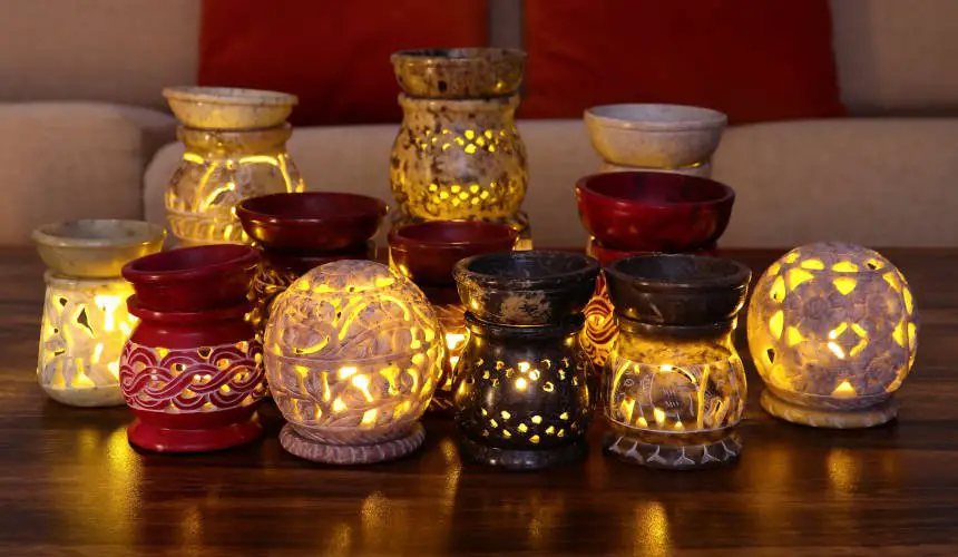 Burners 1 Multiple Soapstone essential oil and incense burners with lit candles inside