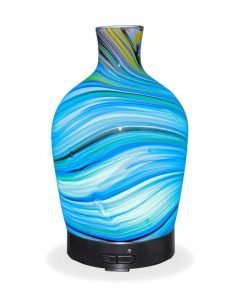 Aromar Glass Abstract Decanter Diffuser with light blue light on a white background