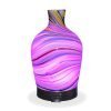 Aromar Glass Abstract Decanter Diffuser with purple light on a white background