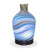 Aromar Glass Abstract Decanter Diffuser with white light on a white background