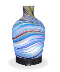 Aromar Glass Abstract Decanter Diffuser with white light on a white background