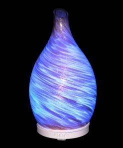 Amphora Copper Diffuser with blue light on a black background