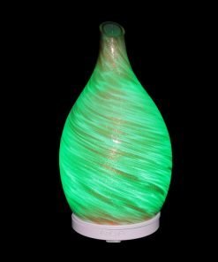 Amphora Copper Diffuser with green light on black background