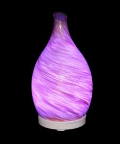 Amphora Copper Diffuser with purple light on a black background