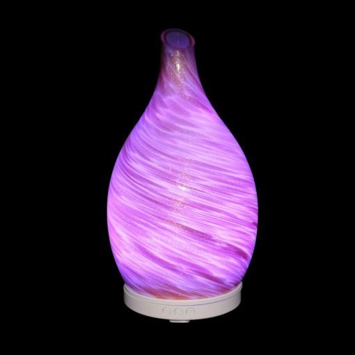 Amphora Copper Diffuser with purple light on a black background
