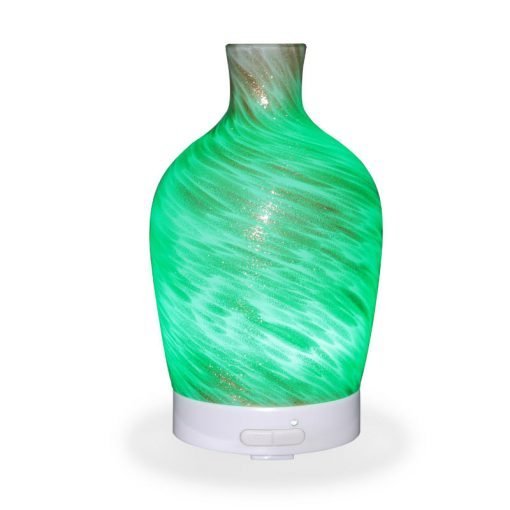Aromar Decanter Abstract Bronze Diffuser with green light on a white background