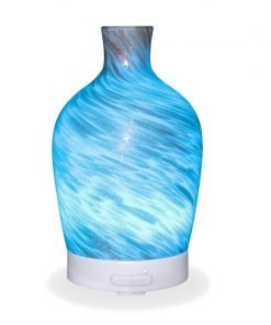 Aromar Decanter Abstract Bronze Diffuser with light blue light on a white background