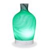 Aromar Decanter abstract grey diffuser with green light on a white background
