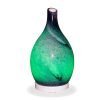 Aromar Rotating Amphora Blue Diffuser with green light on a white background