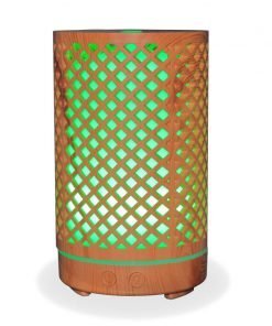 Aromar Tranquil Wood Diffuser with green light on a white background