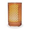 Aromar Tranquil Wood Diffuser with yellow light on a white background