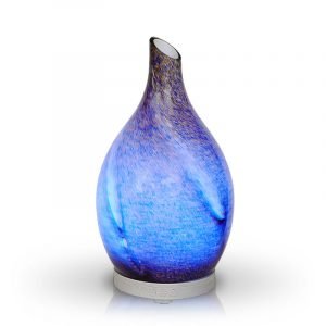Rotating glass Amphora Blue diffuser on white background