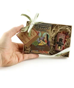 Tulsi gift set with tusli soap bar and Padma oil held in a hand