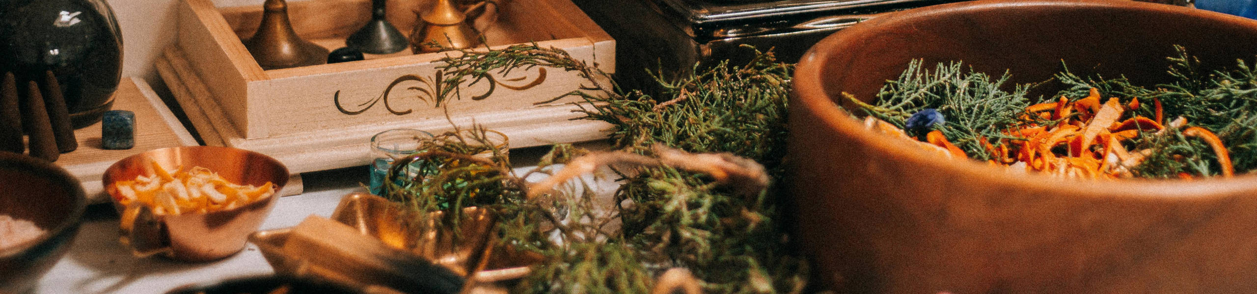 Close up of various herbs in bowls and laying around loose.
