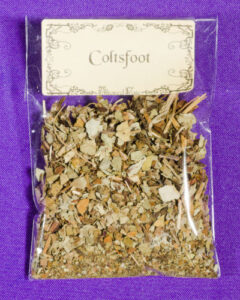 Small package of coltsfoot on a purple background